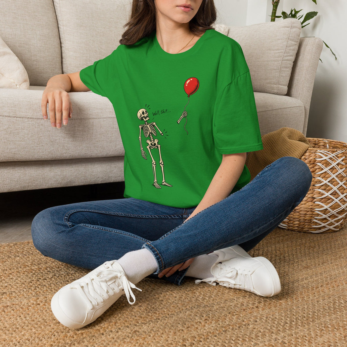 Model wearing the Well Shit Skeleton Balloon Halloween shirt, showing the front design.