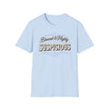 Blessed & Highly Suspicious T-Shirt front view: Flowing vintage script sets up the respectable greeting before bold SUSPICIOUS lettering delivers the second thought.
