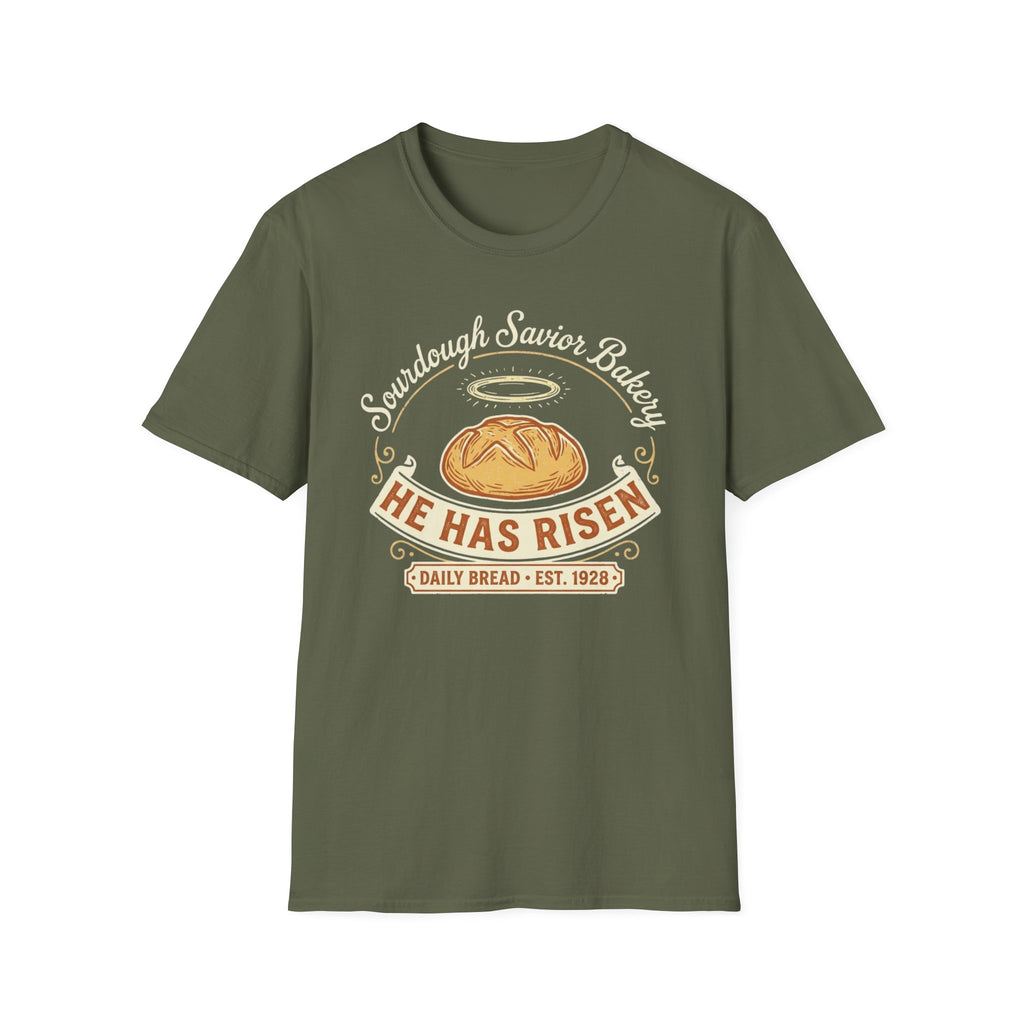 He Has Risen Sourdough T-Shirt front view: A haloed loaf, curling vintage lettering, and a warm bakery banner turn Sourdough Savior Bakery into a cheerful bread-making joke.