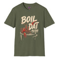 Boil Dat Mud Bug Cajun T-shirt graphic featuring a red crawfish climbing from a boiling pot with bold vintage-style lettering