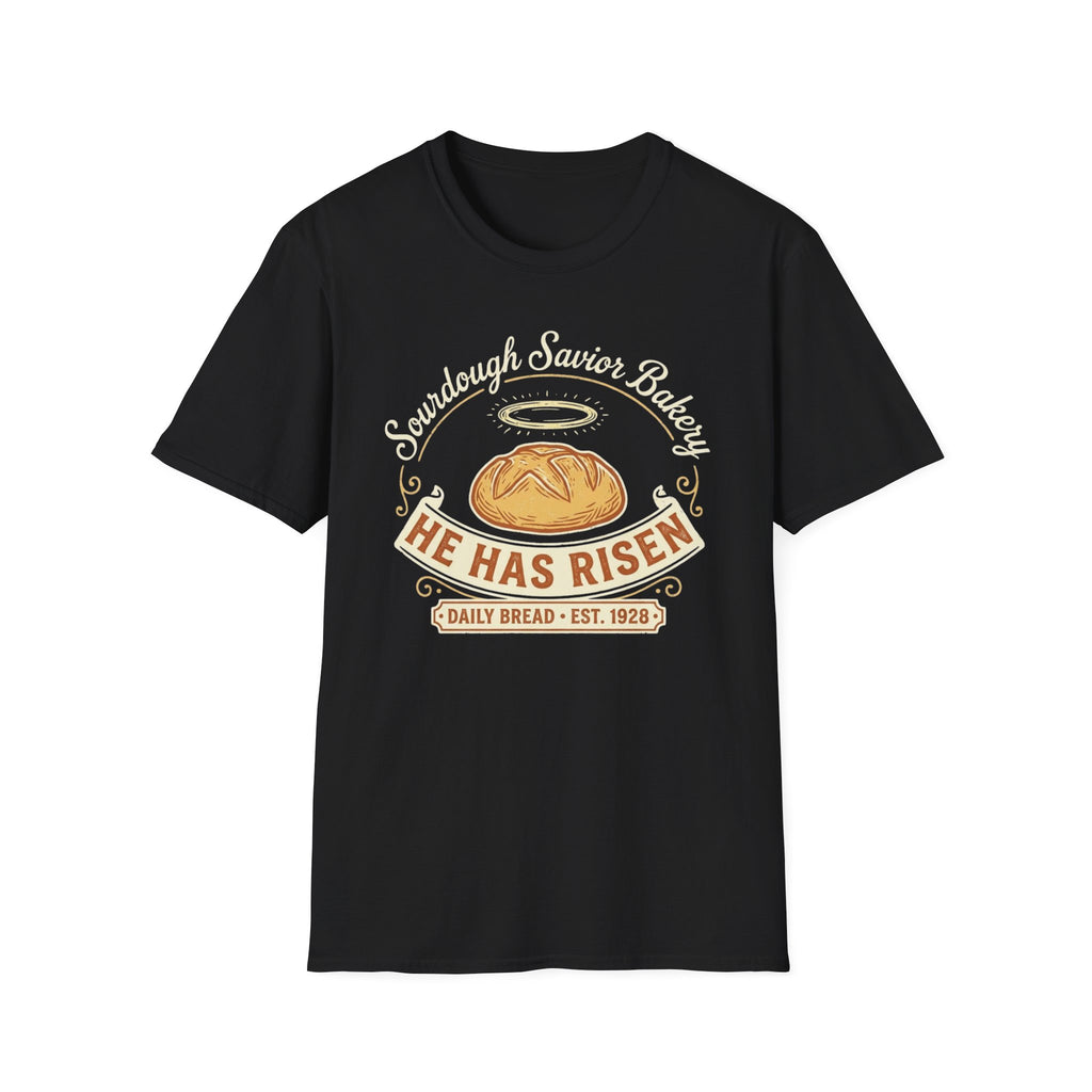 He Has Risen Sourdough T-Shirt front view: A haloed loaf, curling vintage lettering, and a warm bakery banner turn Sourdough Savior Bakery into a cheerful bread-making joke.