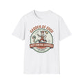 Garden of Eden Pest Control T-Shirt front view: A retro service mascot chases an apple-carrying serpent with a broom inside a vintage trade badge.