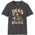 Dead Before Coffee skeleton graphic t-shirt holding steaming coffee mug in vintage horror style