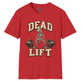A red short-sleeve crewneck t-shirt featuring a vintage-style graphic of a skeleton lifting a barbell, with the words 'DEAD LIFT' printed in beige and brown block letters.