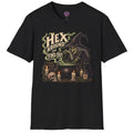 A black short-sleeve crewneck t-shirt featuring a gothic witch graphic on the front. The graphic depicts a witch in a pointed hat looking into a cauldron with the text 'HEX AROUND TO FIND OUT' in a stylized font, surrounded by candles, a skull, and potion bottles.